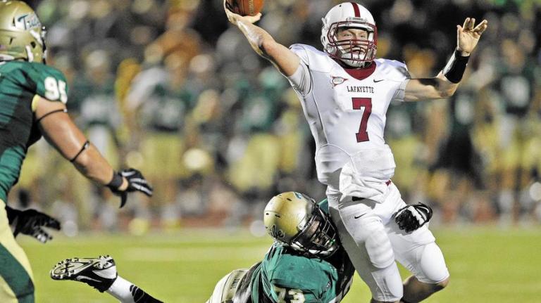 William & Mary's Isaiah Stephens tackles Lafayette quarterback Drew Reed as he throws the ball away during Saturday's game at Zable Stadium. (Jonathon Gruenke, Daily Press) 