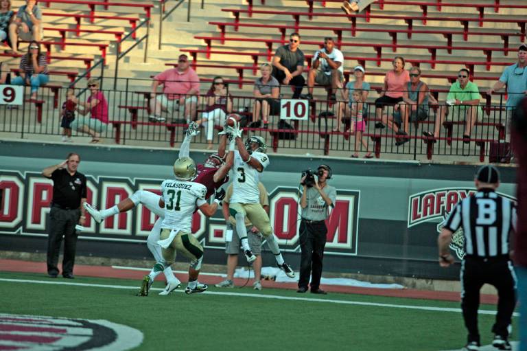 Aaron Swinton goes up for his end zone interception [via tribeathletics.com]