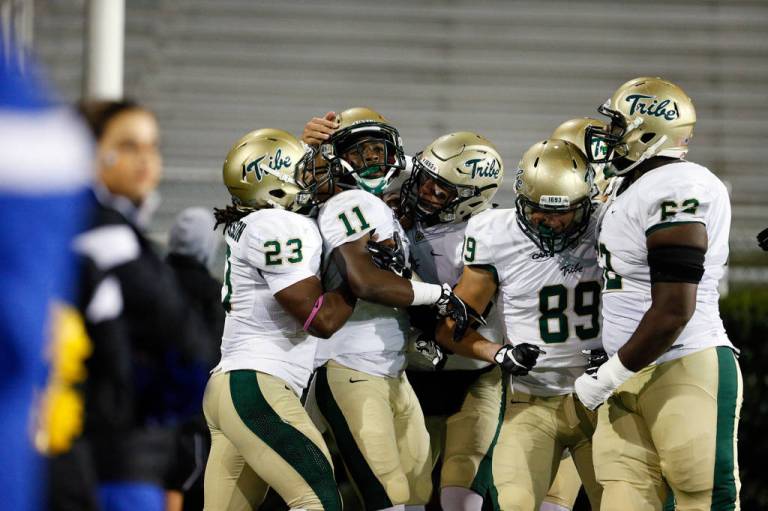 DeVonte Dedmon celebrates his 89-yard kickoff return for a TD in the first quarter. [via tribeathletics.com]