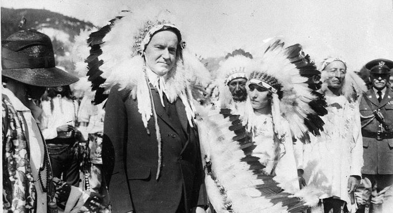 In 1927, President Calvin Coolidge wore a Native American Indian headdress of the Sioux tribe as he was adopted as Chief Leading Eagle. The irony of him wearing this for W&M history is rich. (AP Photo/File)